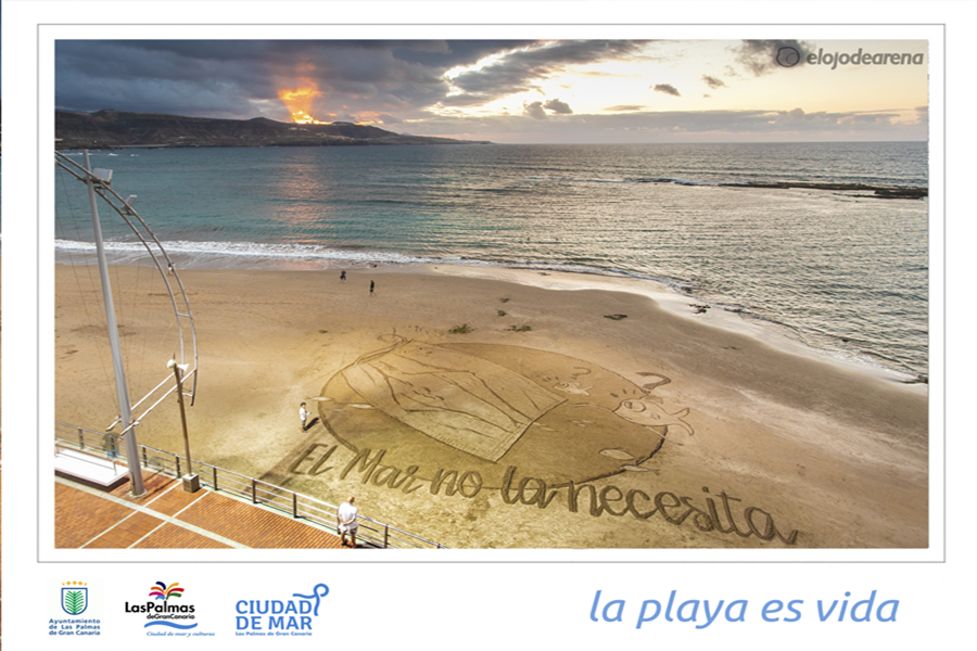 Ciudad de Mar dibuja una gran postal de arena en Las Canteras para denunciar el impacto de las mascarillas abandonadas en el mar